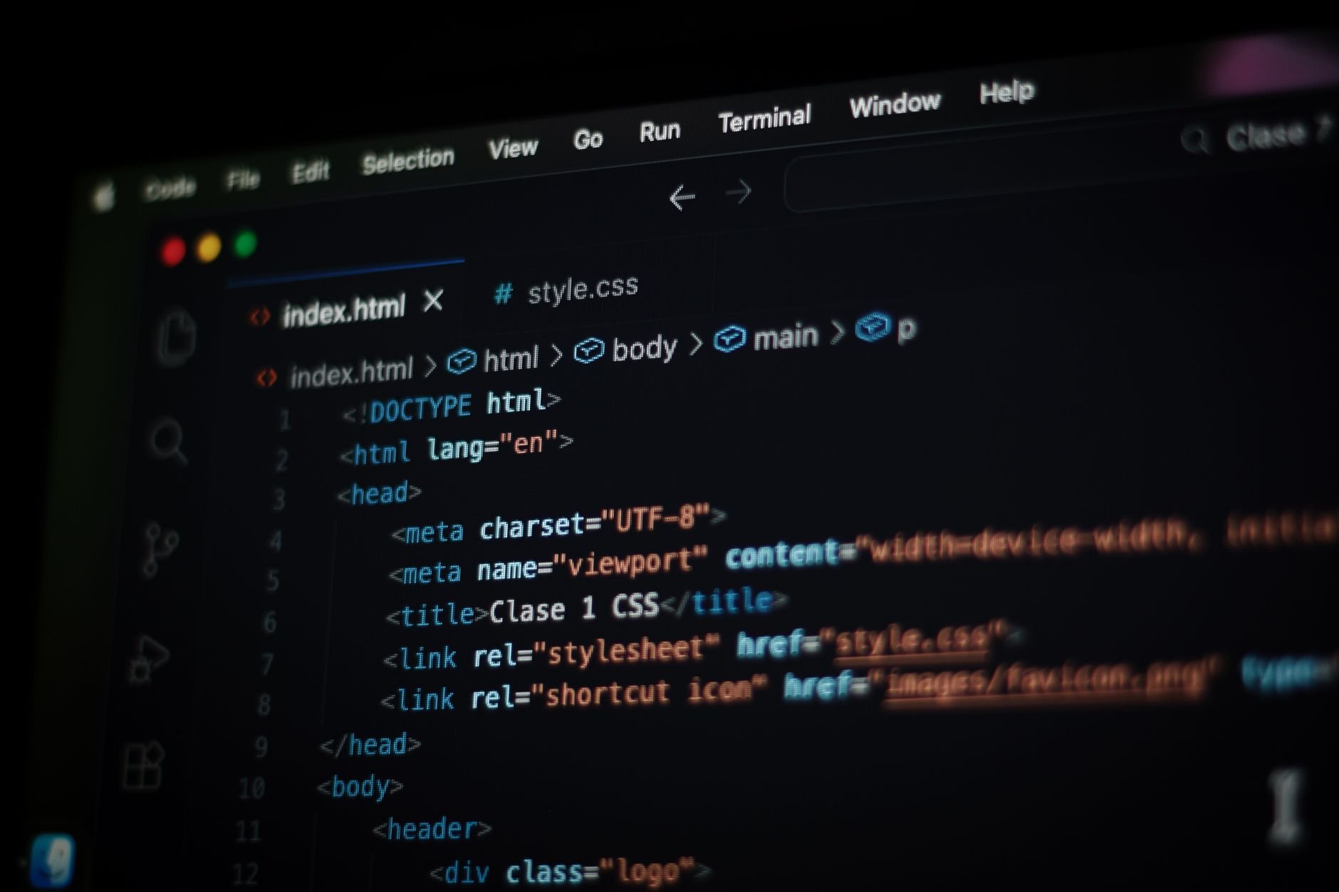 Close-up of code displayed on a computer screen in dark mode.