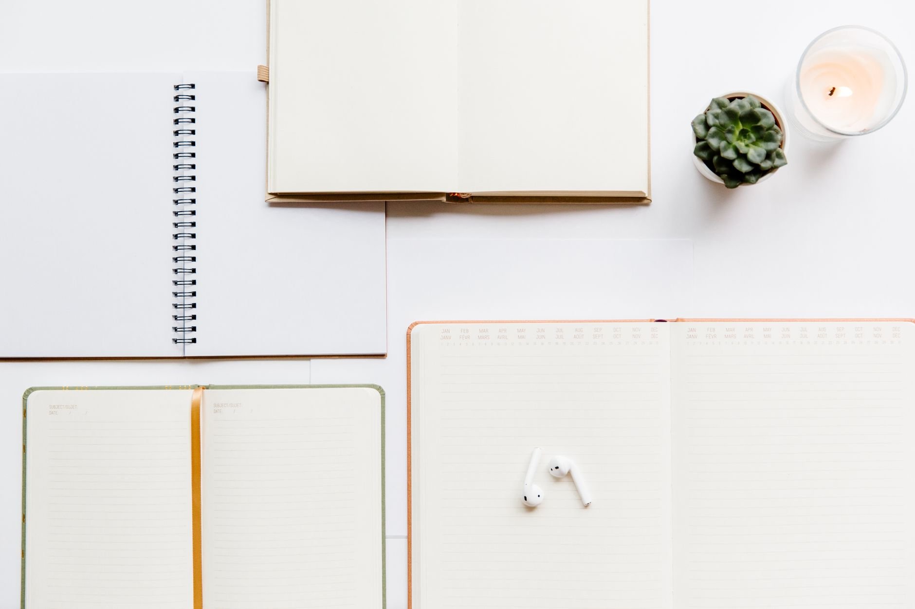 A clean flat lay of notebooks and planners, ideal for productivity and planning themes.